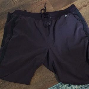 Dark plum gap active joggers, with black striped detail down the leg.